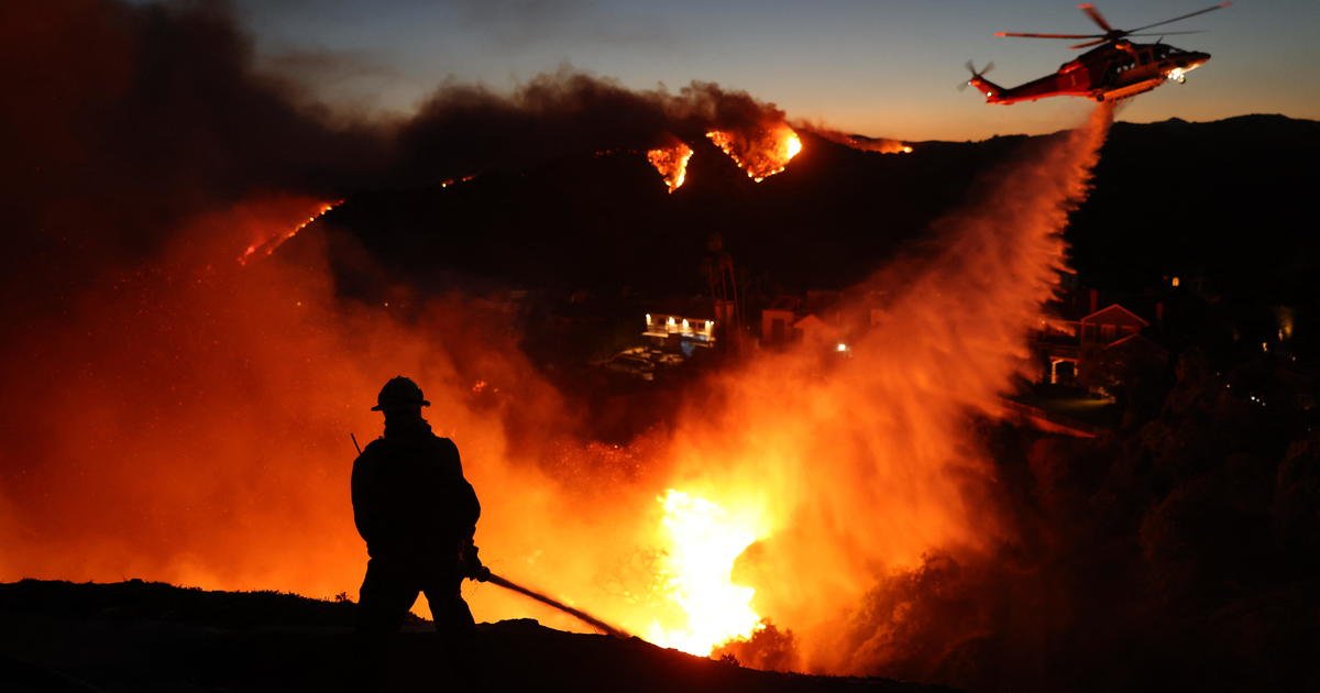 California windstorm fuels Pacific Palisades wildfire as residents flee